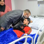 King of Morocco visits earthquake patients at Marrakech, kissing one on head and donating blood